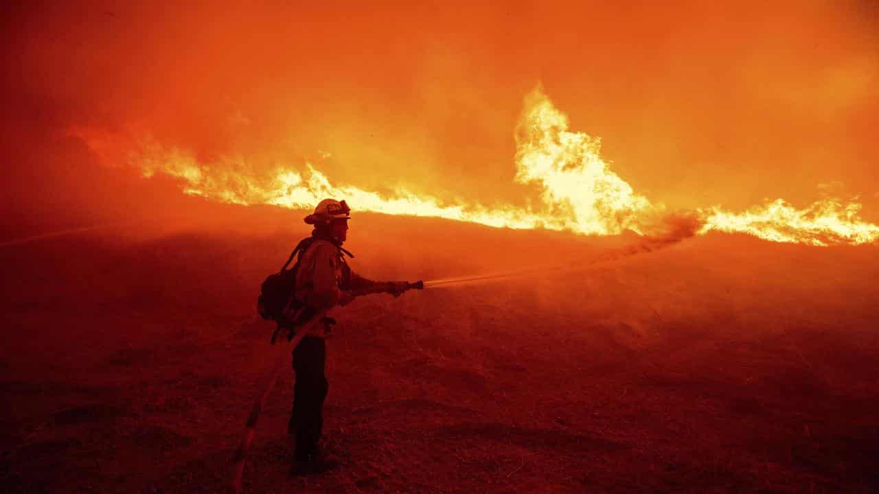 Firefighter tackles Hughes Fire north of Los Angeles