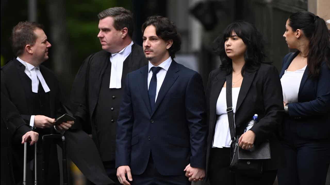 Christopher Joannidis (centre) with lawyers