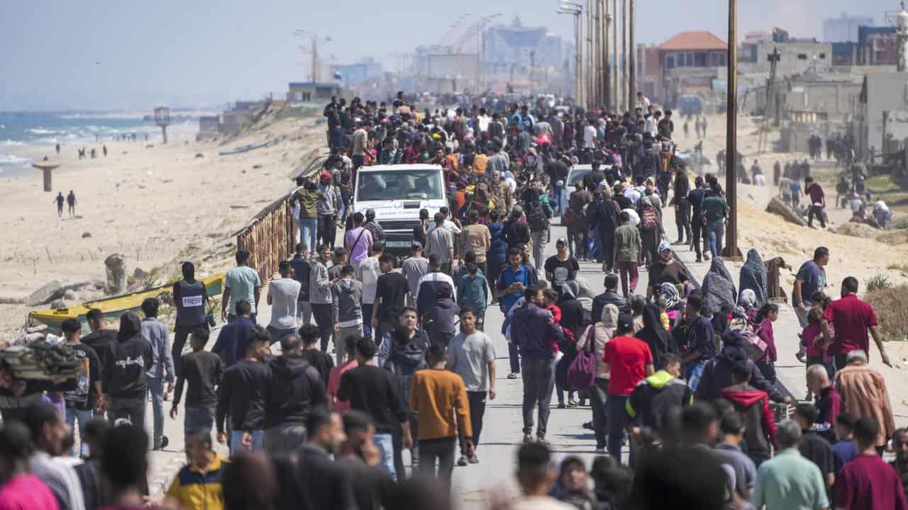 File photo of hundreds of Palestinians walking north from central Gaza