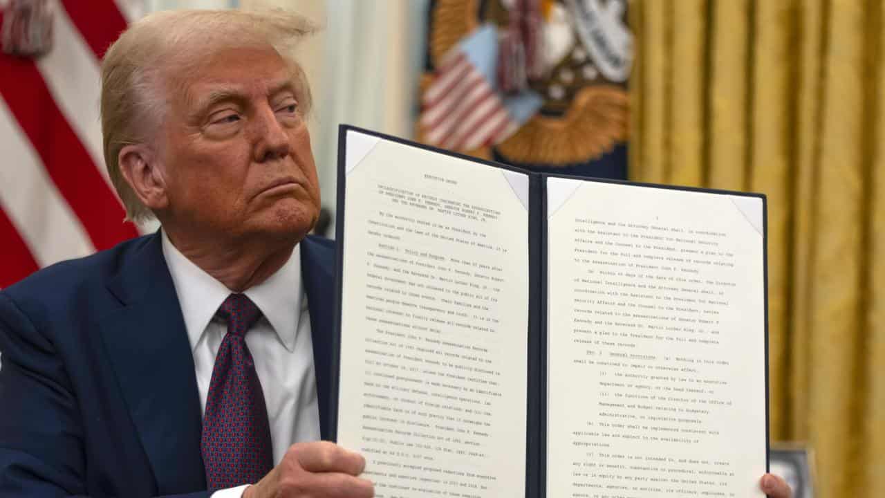 Donald Trump with an executive order.