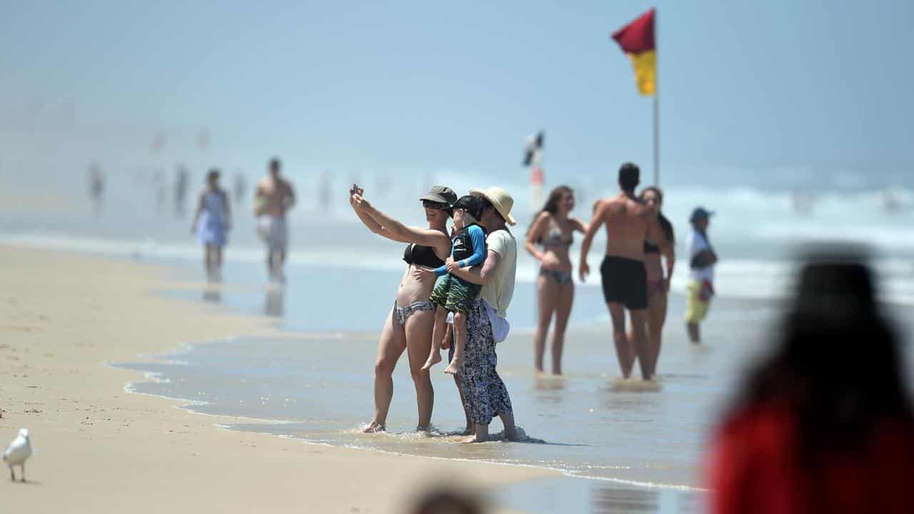 Beachgoers cool down at Surfers Paradise