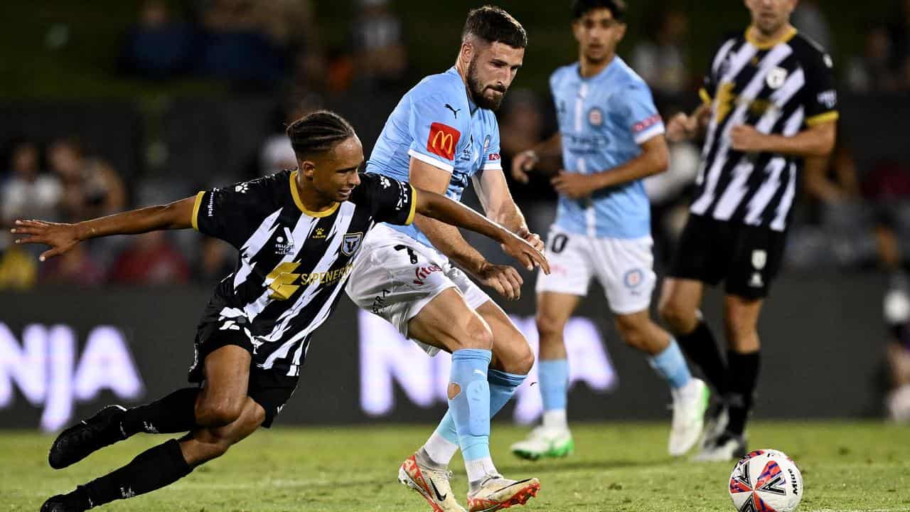 Macarthur's Kealey Adamson (left) and Melbourne City's Mathew Leckie.