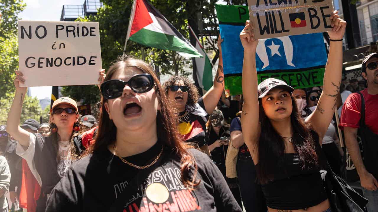 People march during an Invasion Day rally in Melbourne.