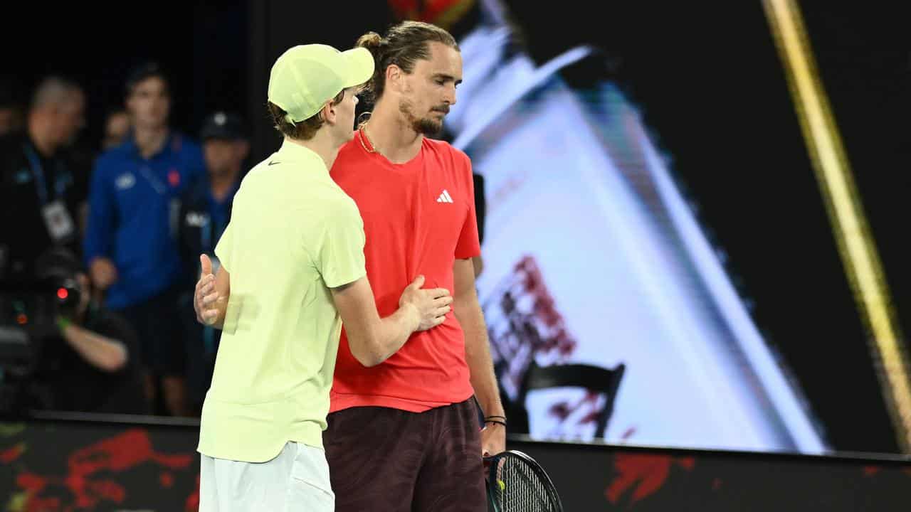 Jannik Sinner consoles Alexander Zverev.