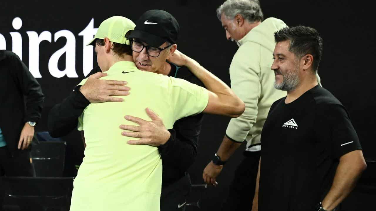 Jannik Sinner (left) hugs his Australian coach Darren Cahill.