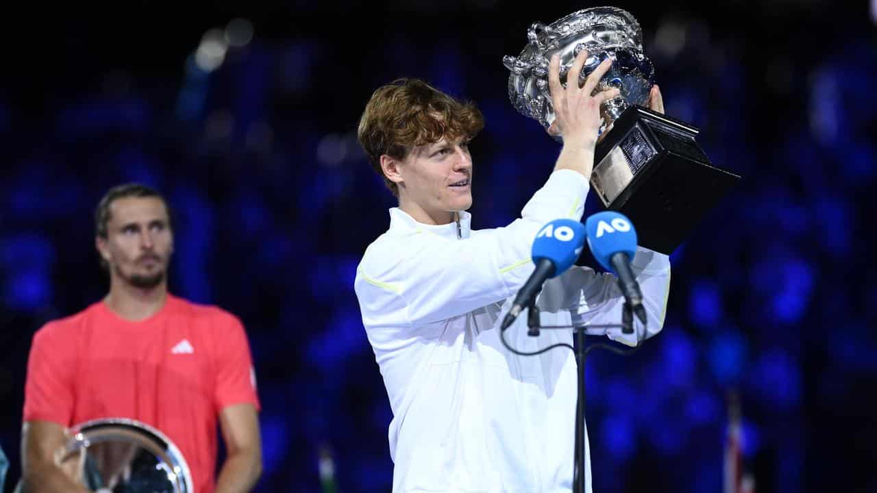 Alexander Zverev (left) looks on as Jannik Sinner.