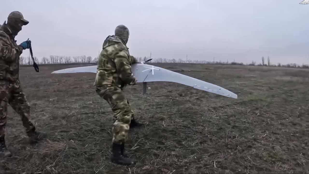 Russian servicemen operate a drone