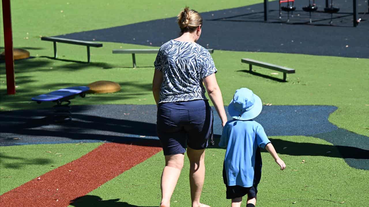 A parent and child are seen at Ormeau State School on the Gold Coast