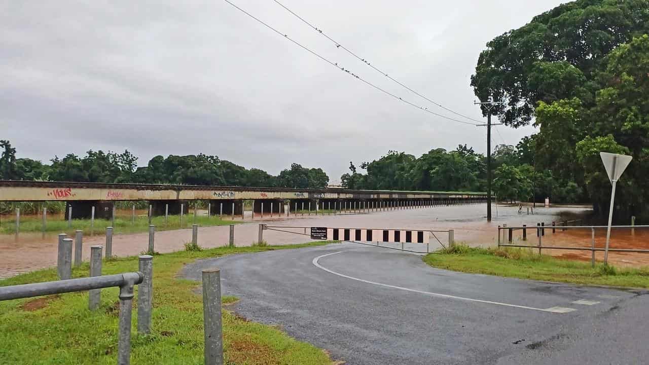 Floodwaters cover a bridge in Cairns