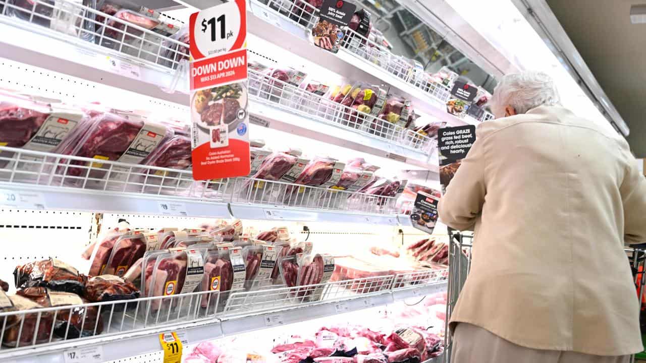 A woman shops for meat