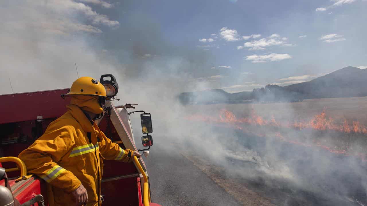 Firefighters conduct backburning on the outskirts of Dunkeld