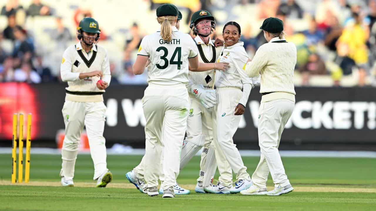 Teammates congratulate Alana King (second right).