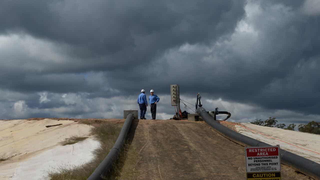 Personnel at a water treatment facility for a gas project