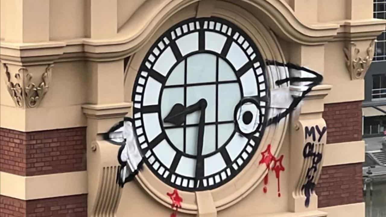 Graffiti on the Flinders Street Station clock tower