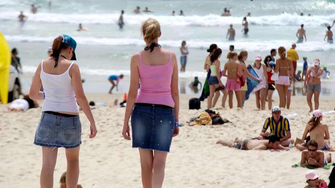 Teenagers at the beach during Schoolies