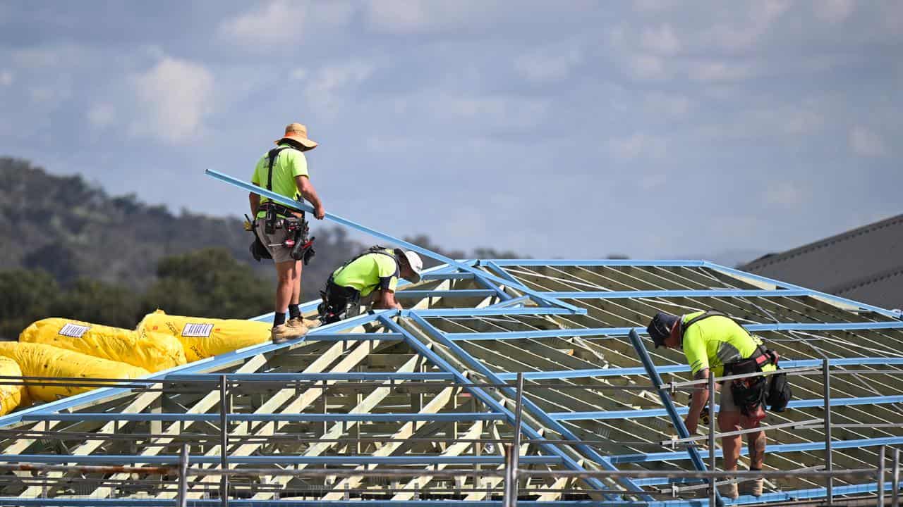 Roofers at work on a building site