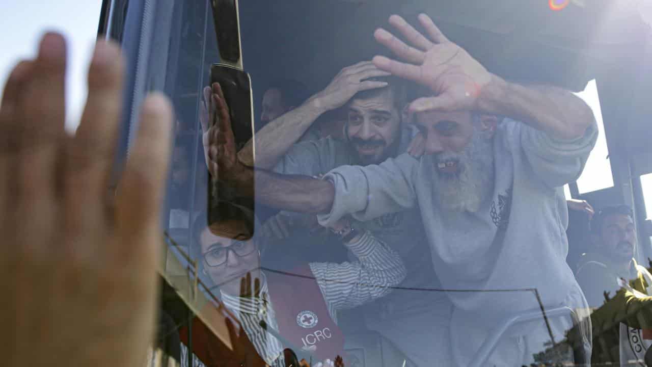 Freed Palestinian prisoners wave