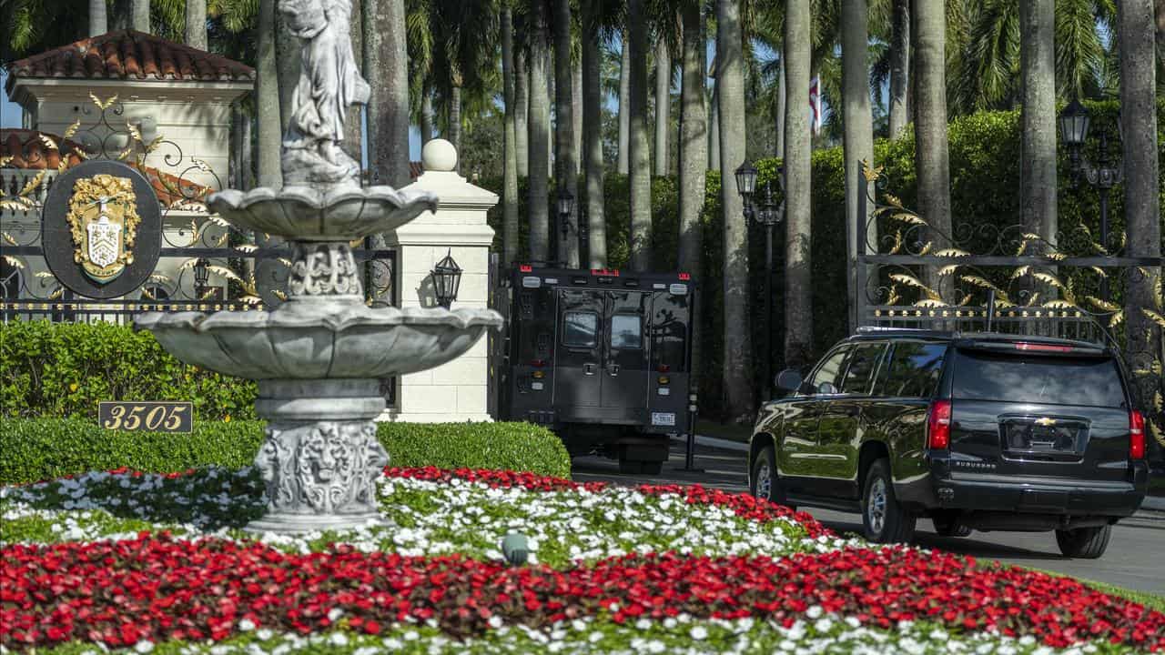 Donald Trump's motorcade enter the Trump International Golf Club