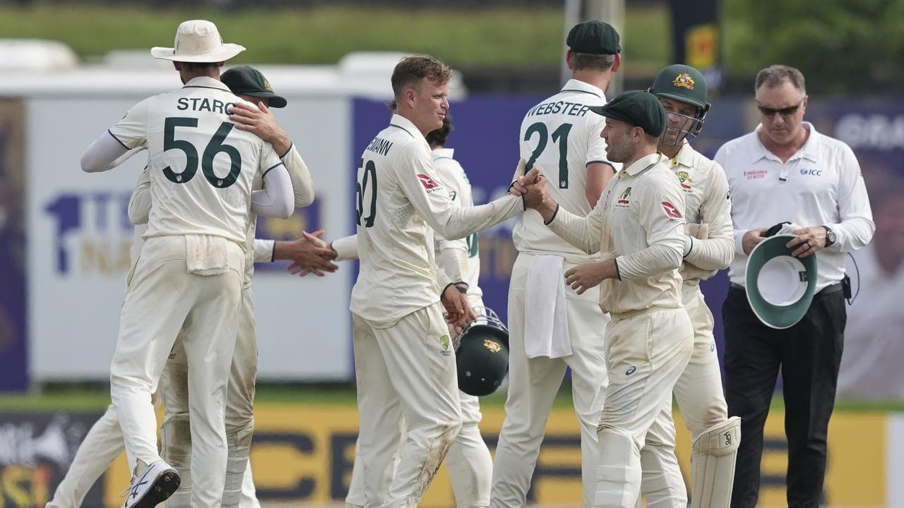 Australian players celebrate their win over Sri Lanka in Galle.