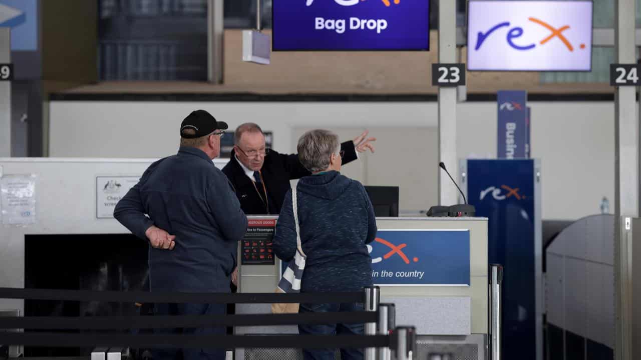 Rex staff and passengers at Sydney Domestic Airport