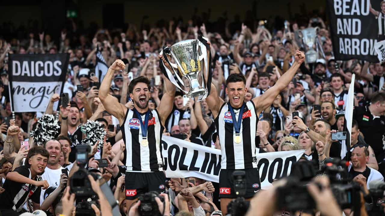 Collingwood with the 2023 premiership trophy.