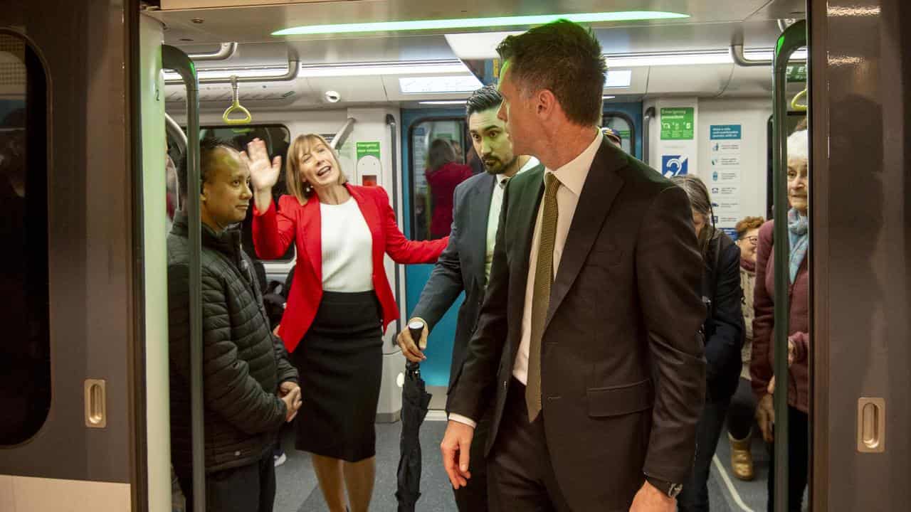 Transport Minister Jo Haylen waves to NSW Premier Chris Minns