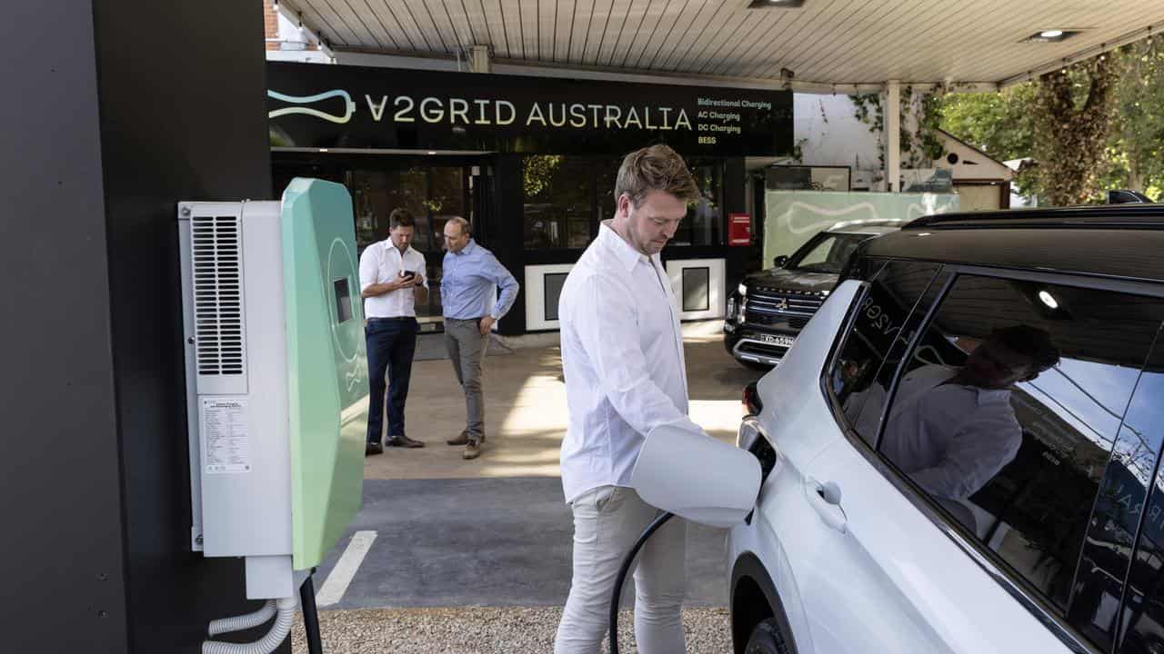 V2Grid co-founder Matthew Downie charges a car