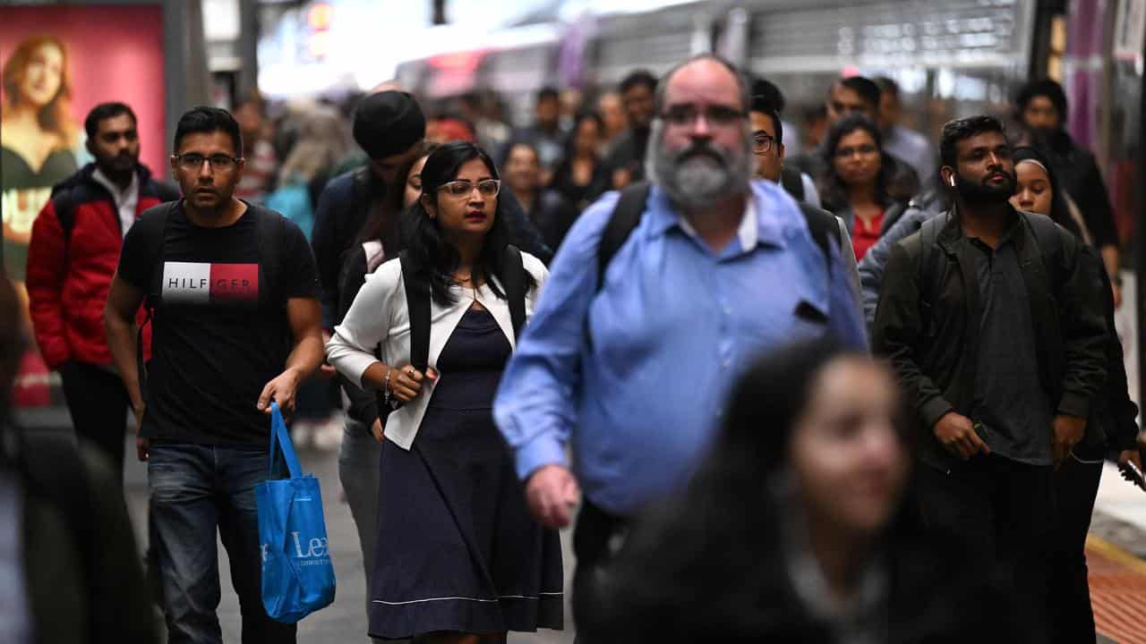 People are seen disembarking a V/Line train