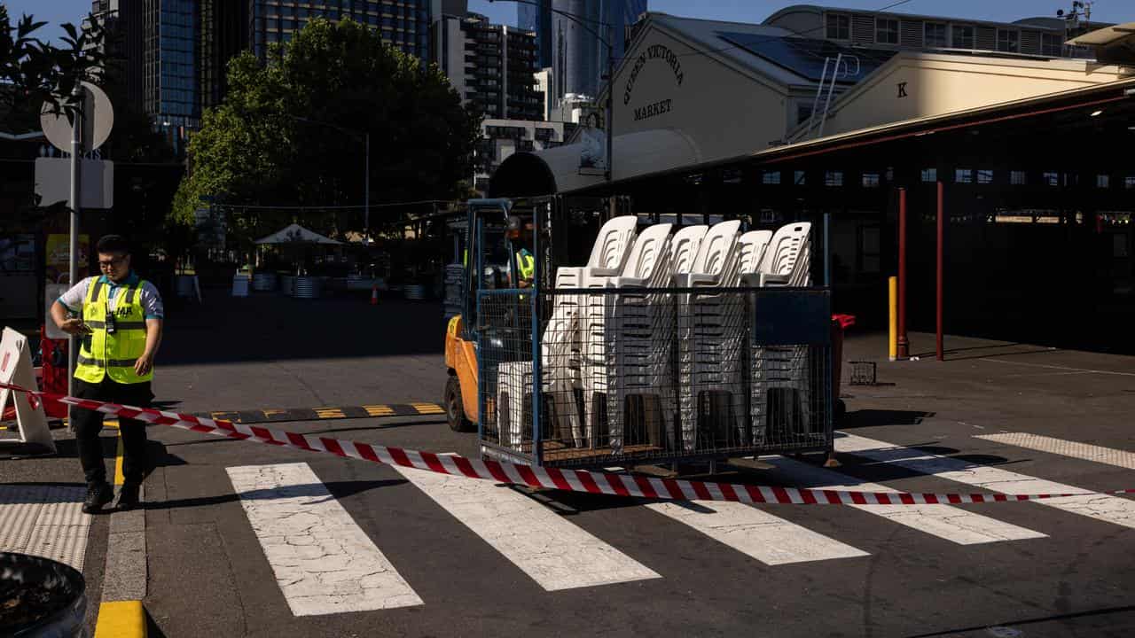 Workers are seen at the Queen Victoria Market