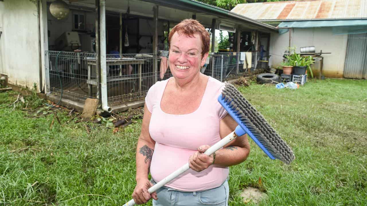 Woman cleaning up after floods