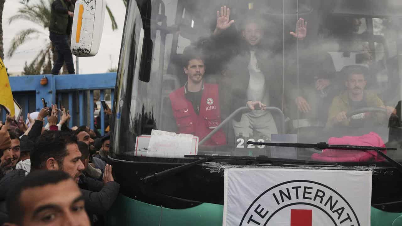 Freed Palestinian prisoners are greeted by a crowd