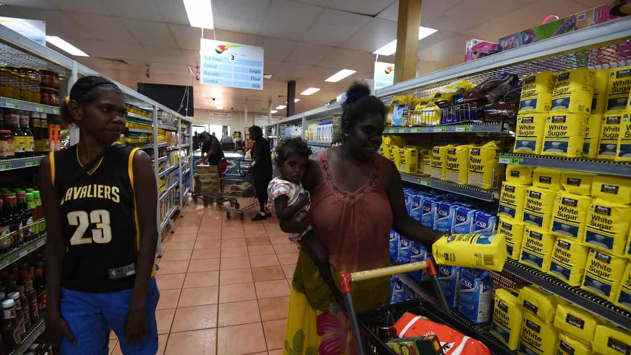 Shoppers at a general store in a remote community (file image)