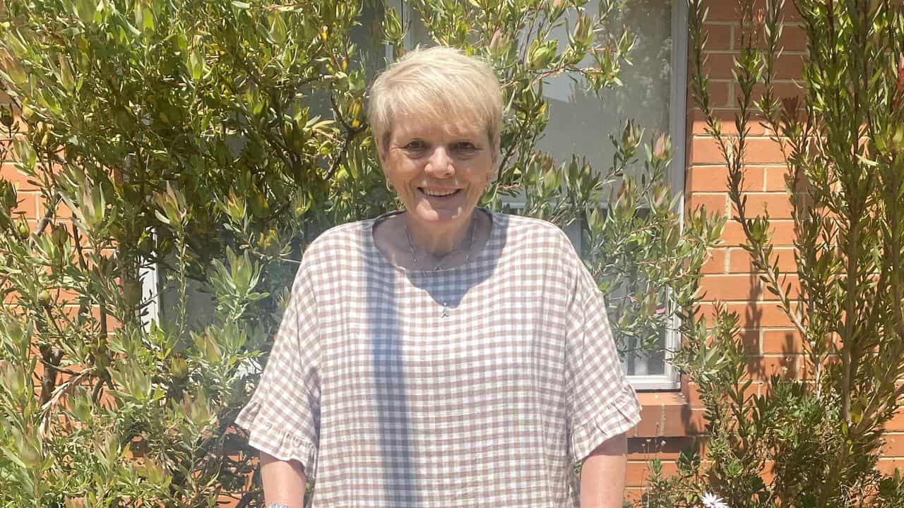 Dementia patient Annette poses for a photo