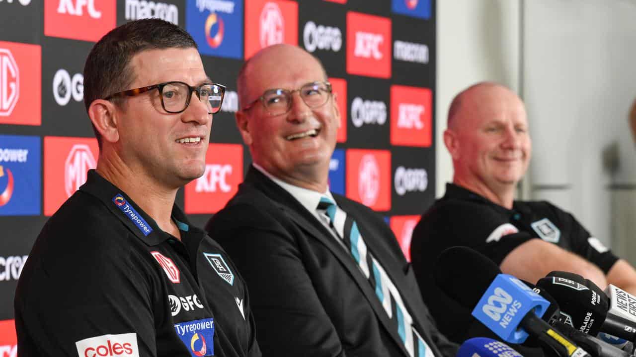 (from left) Josh Carr, David Koch and coach Ken Hinkley.