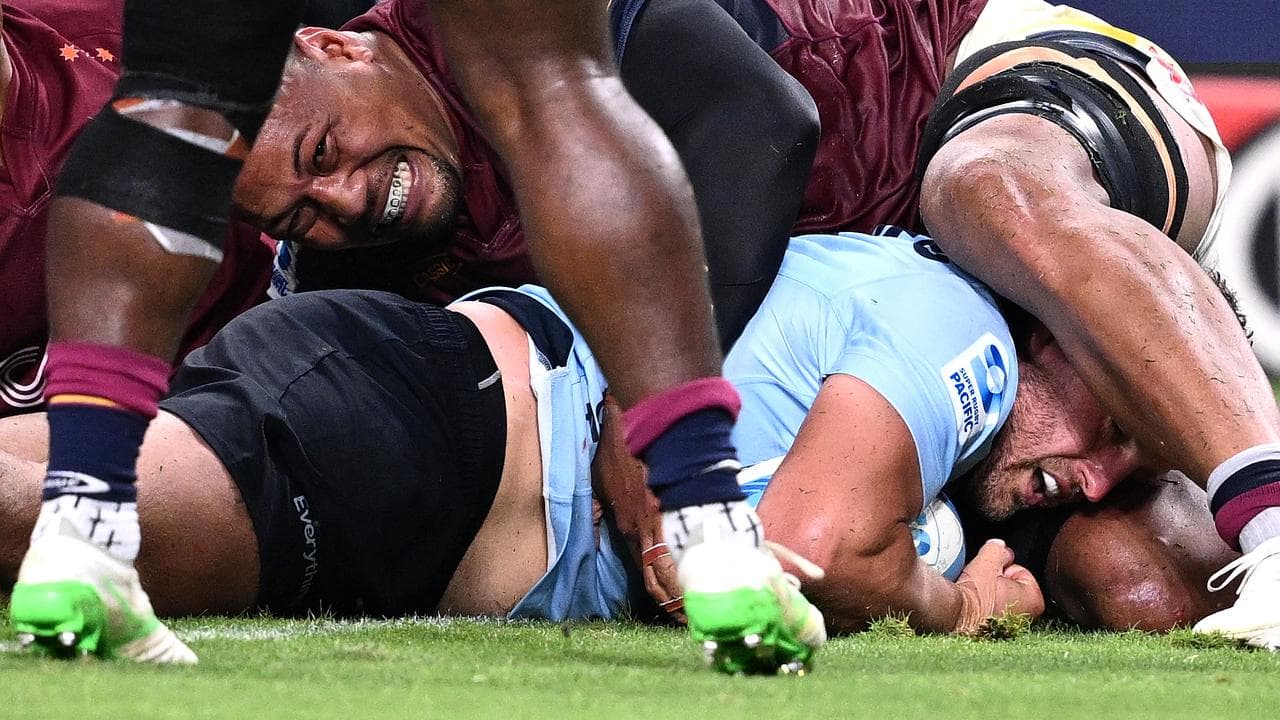 Dave Porecki of the Waratahs scores a try against the Highlanders.