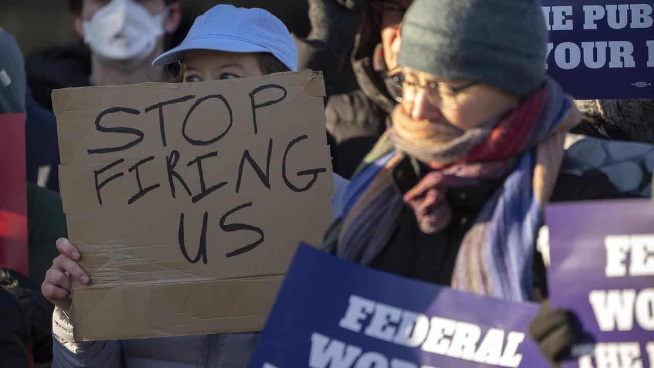 Demonstrators rally in support of federal workers