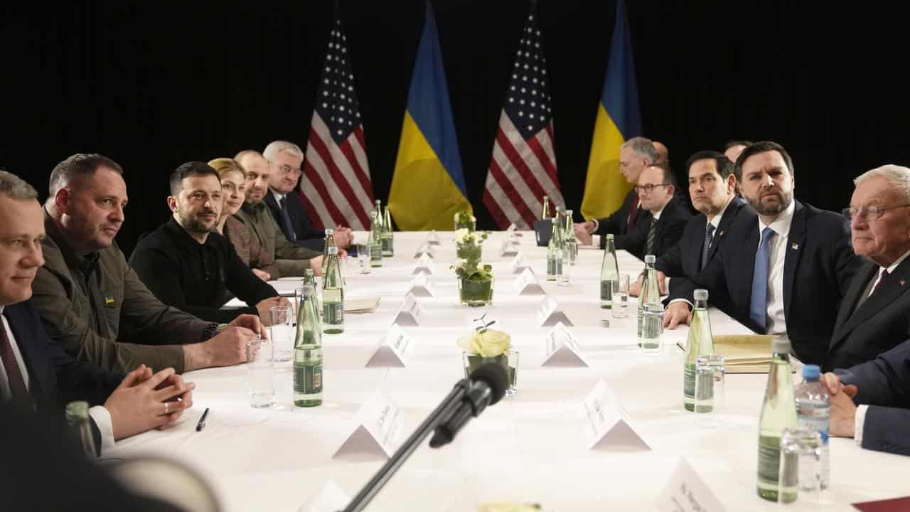 Ukrainian and US officials at a table