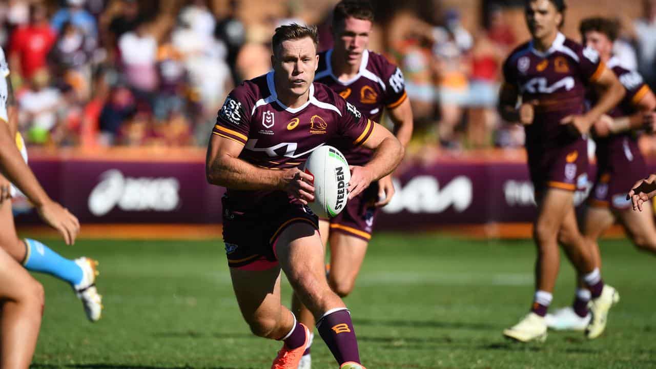 Billy Walters makes a run for the Broncos.