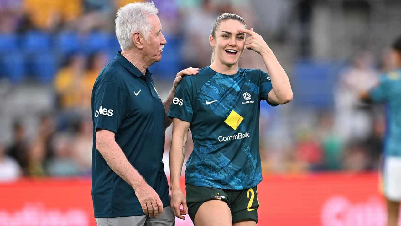 Tom Sermanni, pictured with Ellie Carpenter.