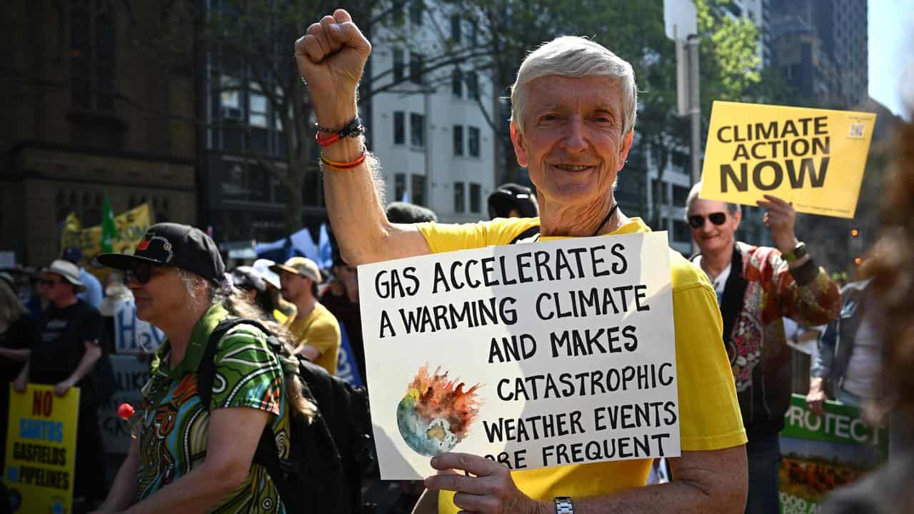 People rally during a protest against Santos