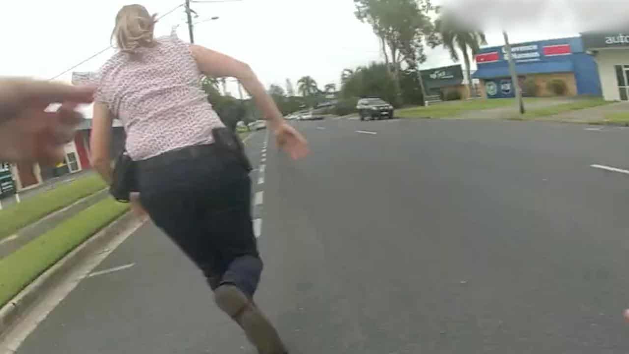 A screengrab from police video of officers chasing a teenage boy