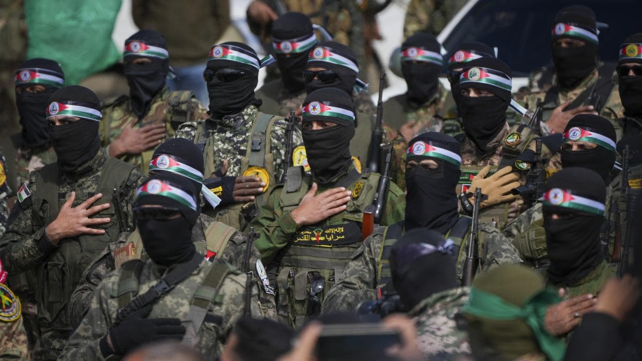 Hamas fighters stand in formation