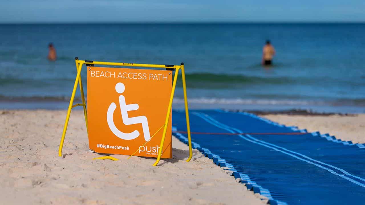 Wheelchair access signage at a beach