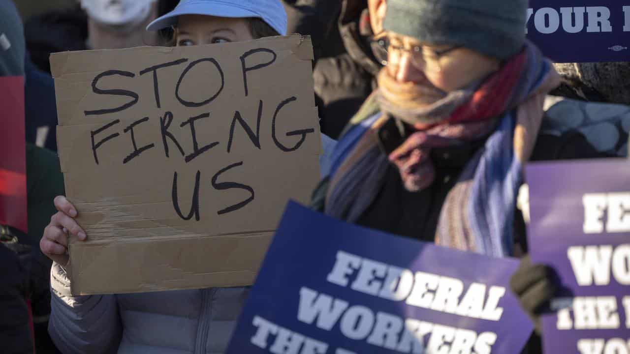 Demonstrators rally in support of federal workers (file image)