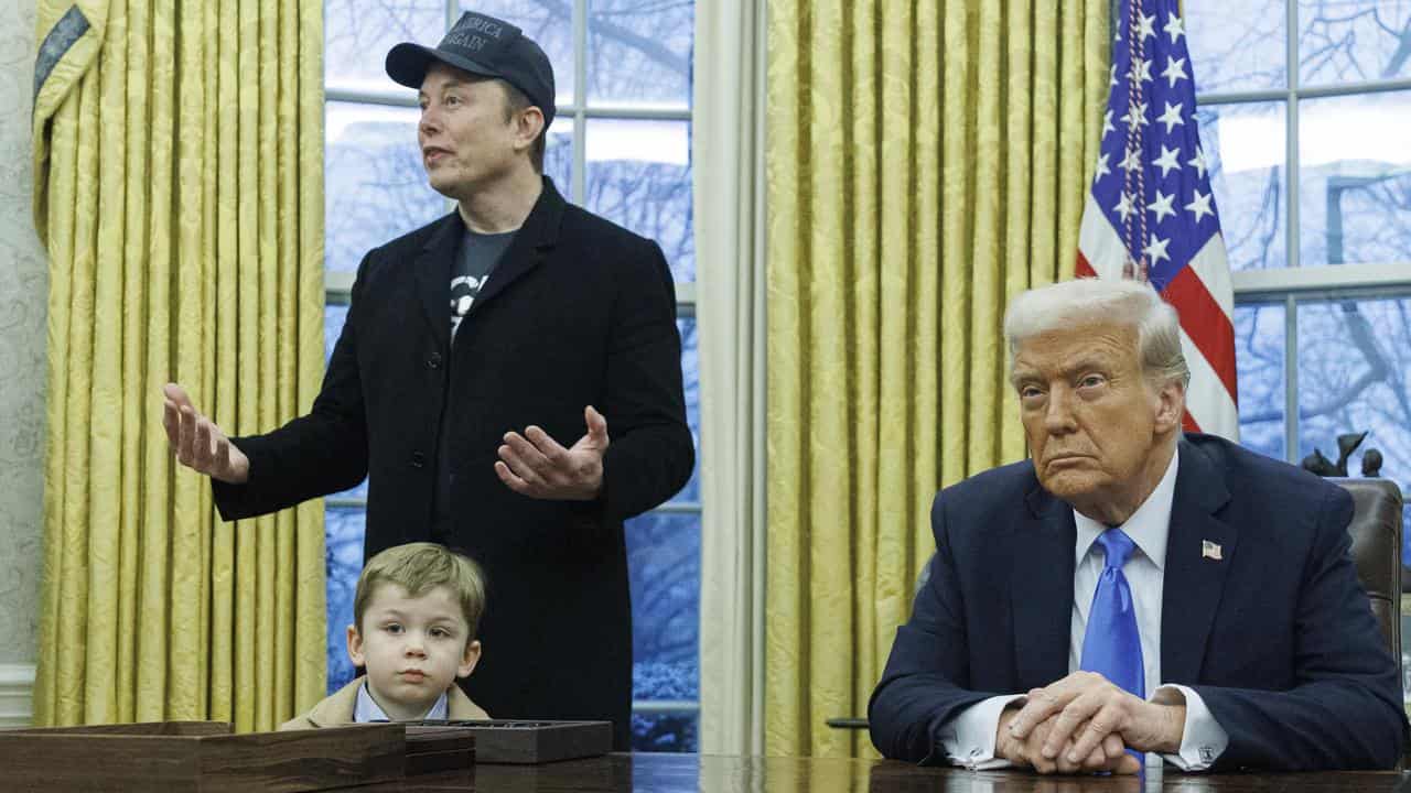 Donald Trump, Elon Musk and Musk's son X in the Oval Office.