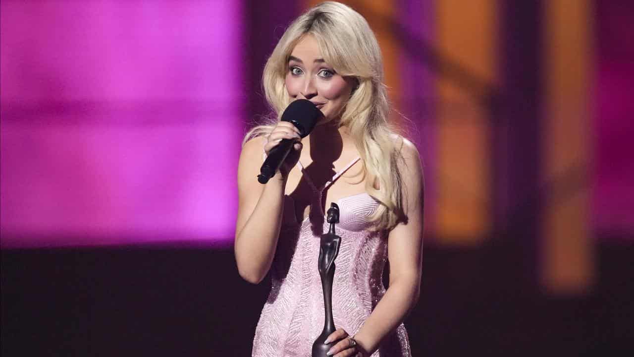 Sabrina Carpenter accepts the global success award