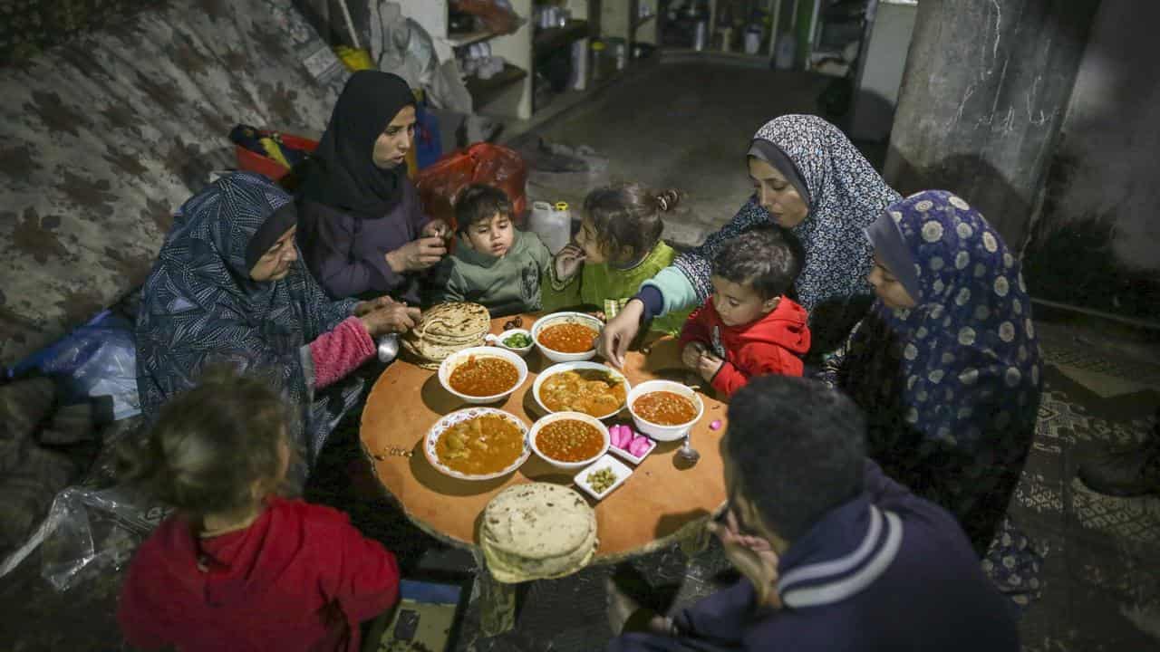 A family eats a meal in Gaza 