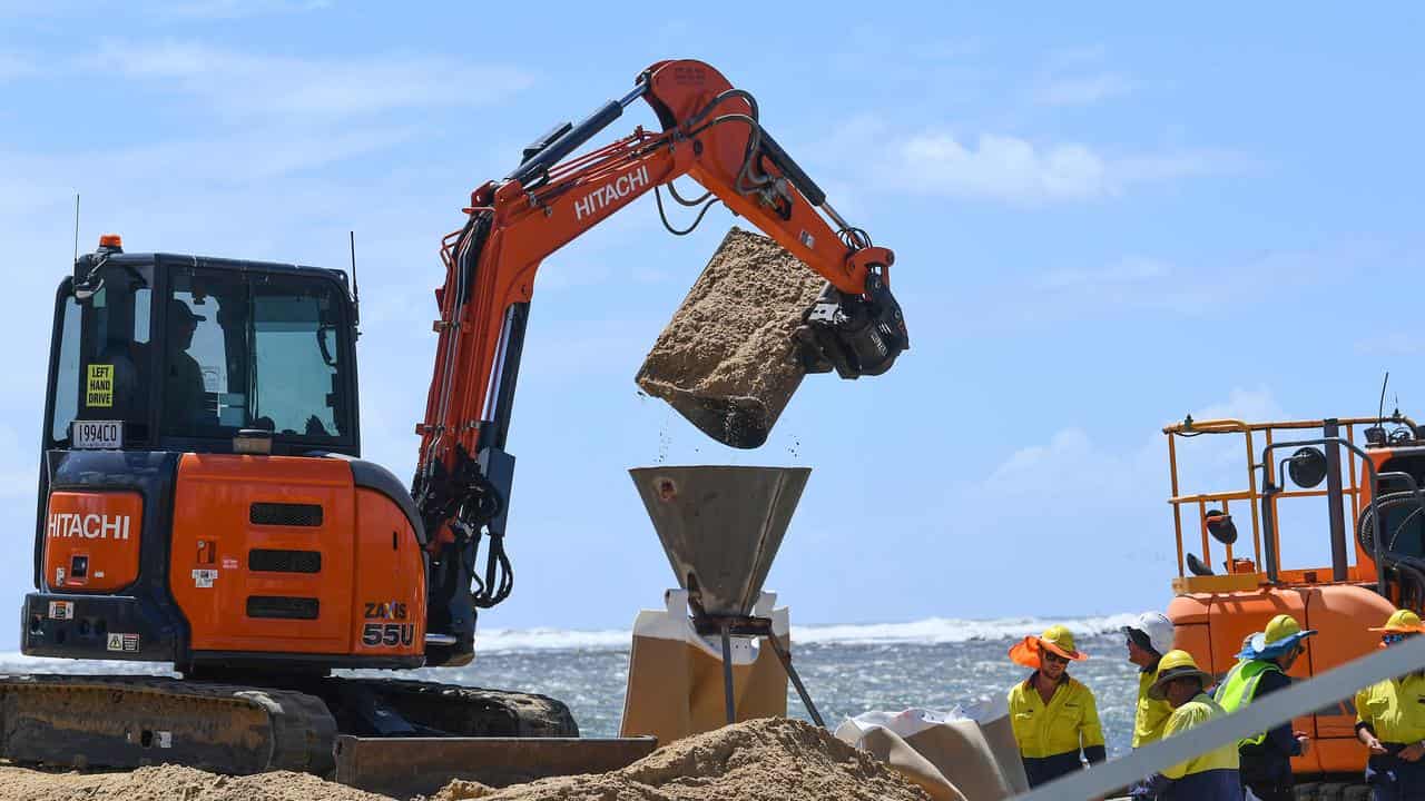 Giant sandbags are laid at Caloundra 