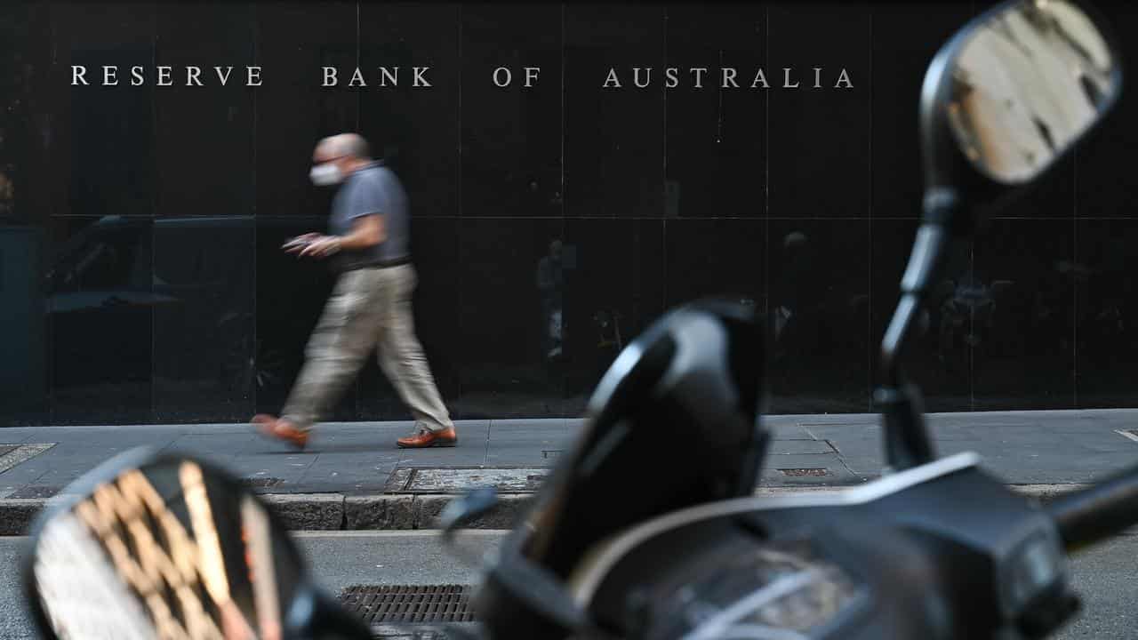 Person walks past the Reserve Bank of Australia