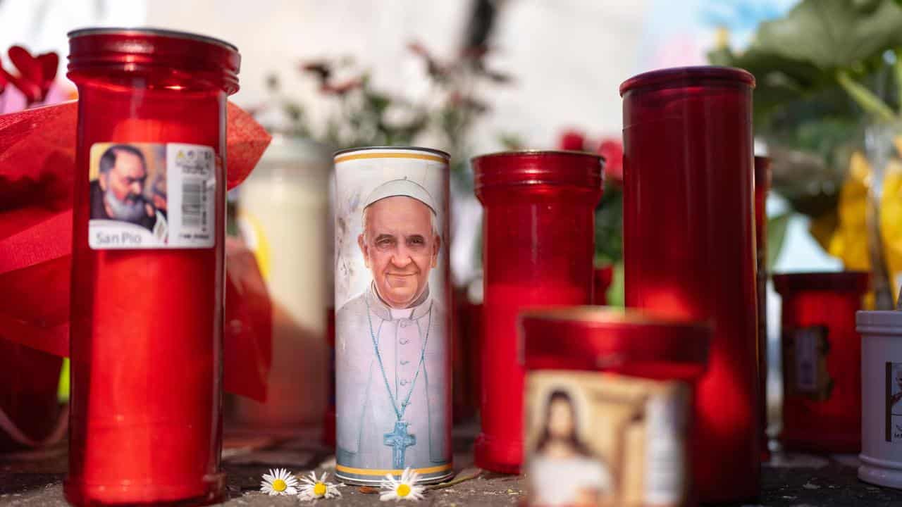 Candles left outside the Agostino Gemelli Polyclinic, in Rome